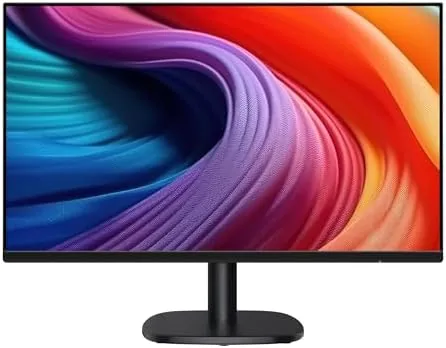 Amazon Basics 24 inch monitor on a desk showing a spreadsheet