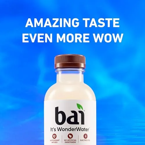 A bottle of Bai Molokai Coconut on a desk next to a laptop