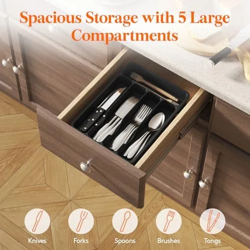 A hand opening the kitchen drawer showing the organizer in place with full silverware