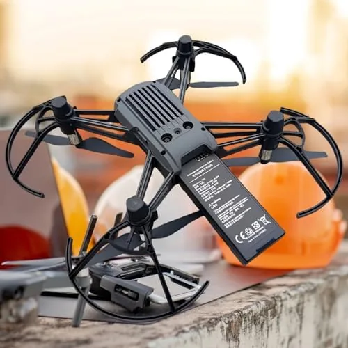 A Tello drone with one of the replacement batteries being installed
