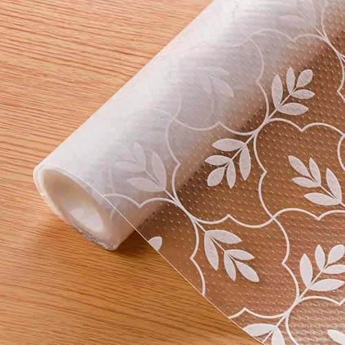 Roll of Cooyes leaf patterned shelf liner laid across a kitchen counter