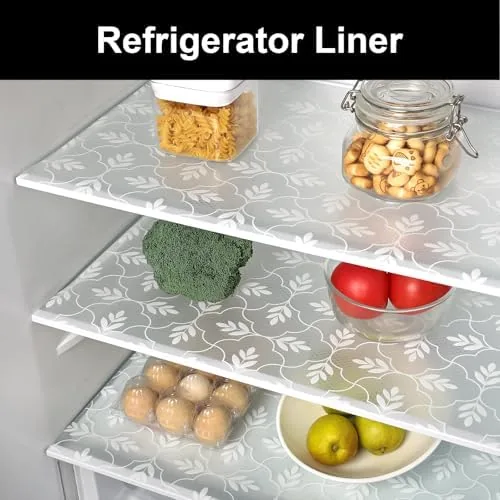 Refrigerator shelf lined with the mat catching a bottle drip