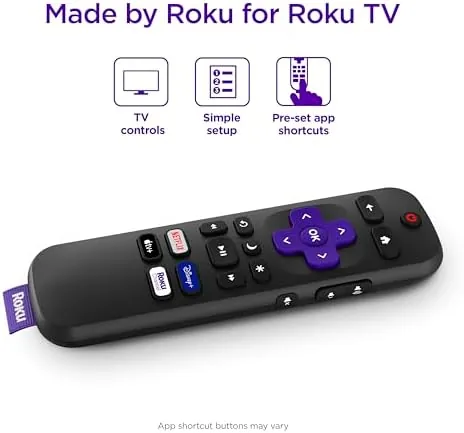 Hand holding the remote and pressing the voice search button