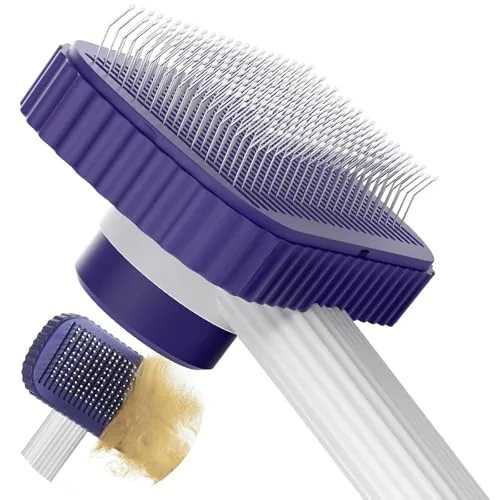 The dark blue cat brush with rounded pins held in a hand