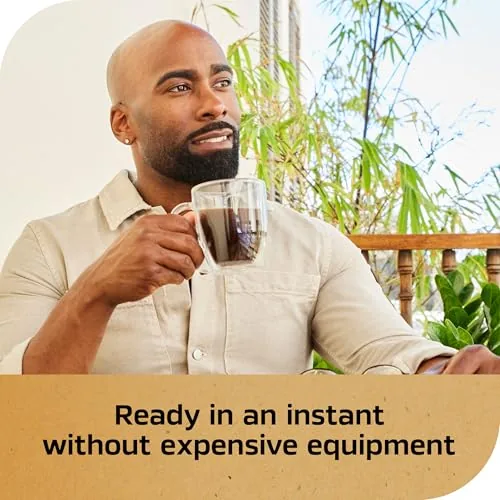 The NESCAFÉ Gold jar next to a dark instant coffee and a home espresso machine