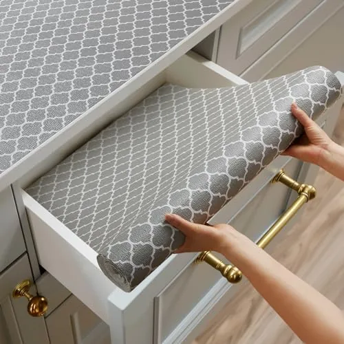 Gray non-adhesive shelf liner roll with scissors and a ruler