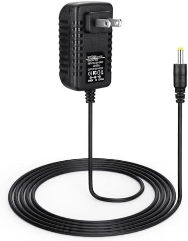 15W black power adapter with a 5 foot cable coiled on a table