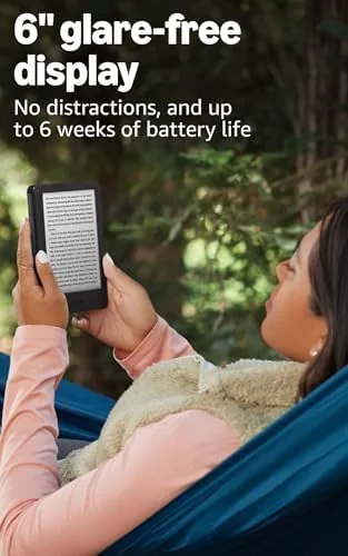 The new Kindle 16 GB in black compared with a Kindle Paperwhite and a smartphone