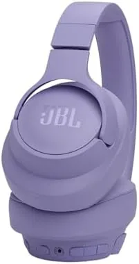 JBL Tune 770NC being worn on a commute with a busy street behind
