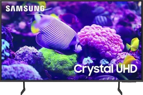The Samsung 65-inch Crystal UHD DU7200 mounted on a wall showing a vivid nature scene