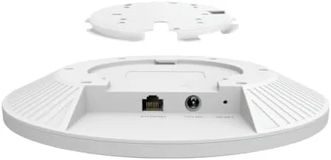 A laptop running a speed test connected to the Omada EAP673