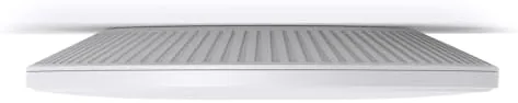 The Omada EAP673 mounted on a wall with a PoE switch below