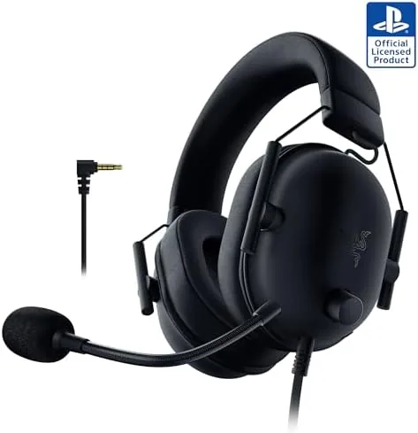 Razer BlackShark V2 X wired headset in black resting beside a PlayStation 5 controller
