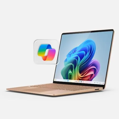 The Microsoft Surface Laptop 2024 open on a desk in the Dune color