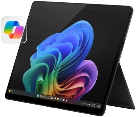 The Microsoft Surface Pro OLED standing with the kickstand on a desk