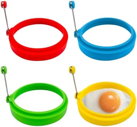 The four silicone egg rings in a row on a counter