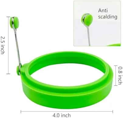 An egg cooking inside one of the silicone rings in a pan