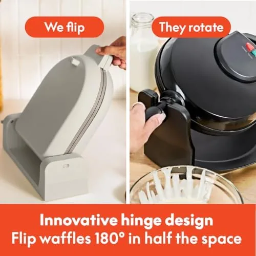 A golden waffle being lifted from the open plates