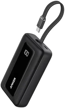 The slim black Anker 10,000mAh power bank held in a hand