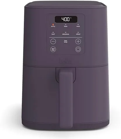 The Plum Bella Slim 4.0 QT air fryer sitting on a kitchen counter with a basket of fries