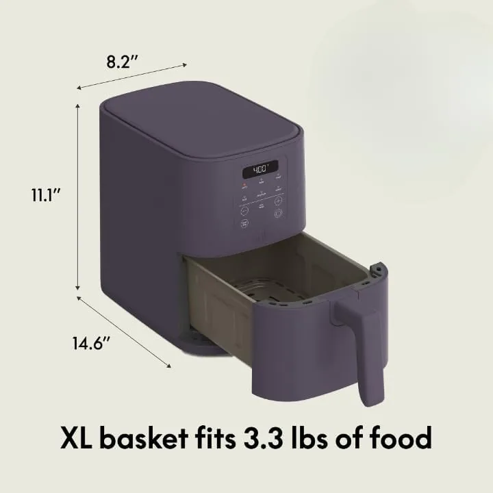 The nonstick basket and tray sitting in a dishwasher rack after cleaning