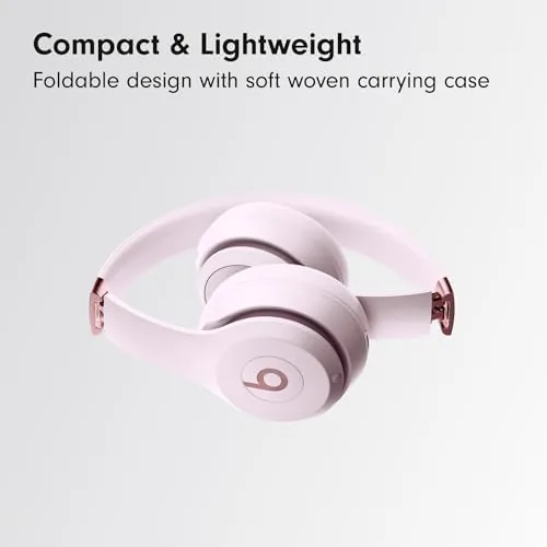 Beats Solo 4 worn by a person at a cafe table