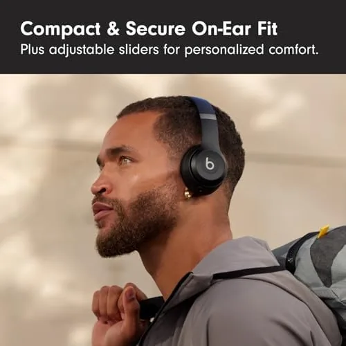 Beats Solo 4 Matte Black being charged with a USB-C cable