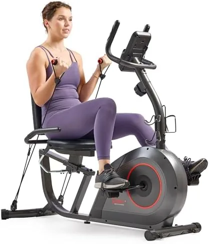 Rider using the Sunny recumbent bike while watching television