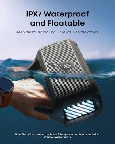 Soundcore Boom 2 on a patio table with evening lights