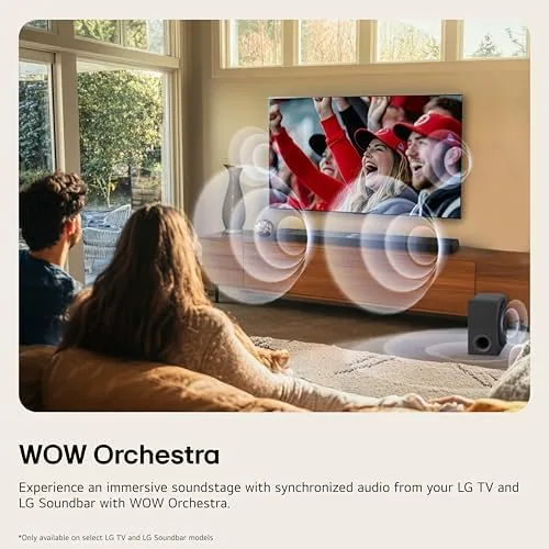 A movie scene playing on the TV with the soundbar and rear speakers lit in the room