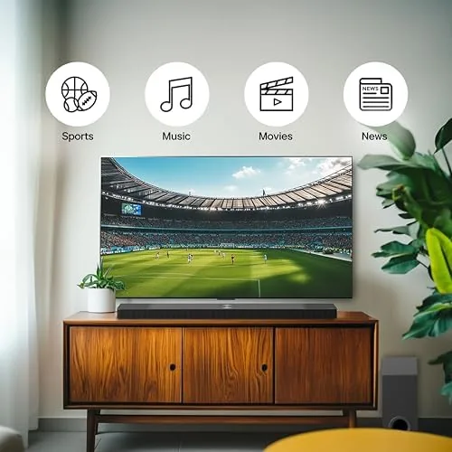 A person controlling the soundbar with the LG remote and the Wow Interface on screen