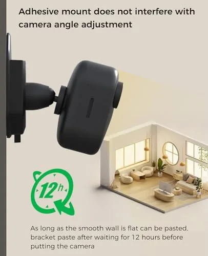 A Blink Mini camera mounted on painted drywall in a home office corner
