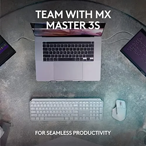 MX Keys S beside a mechanical keyboard for comparison