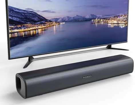 The RIOWOIS 17 inch sound bar sitting beneath a TV on a media stand