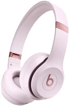 Beats Solo 4 headphones in Cloud Pink on a flat surface