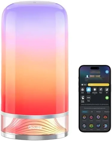 The Govee RGBIC Smart Table Lamp 2 glowing with a gradient of colors on a nightstand