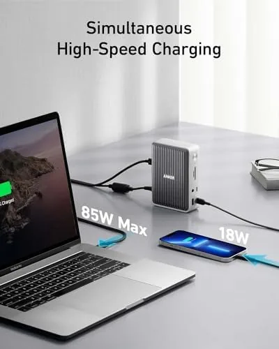 Laptop connected to the dock with a single cable on a tidy desk