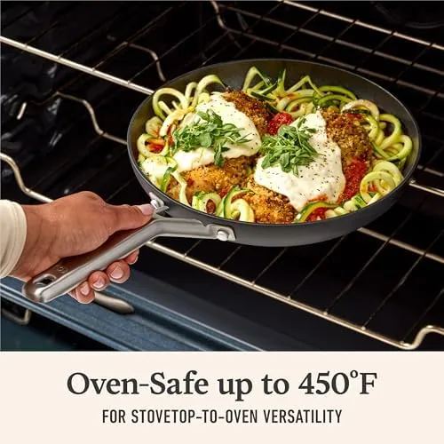 A finished omelet sliding out of the pan onto a plate