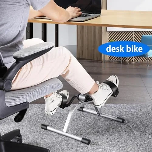 Older adult using the RYGEO exerciser from a comfortable armchair
