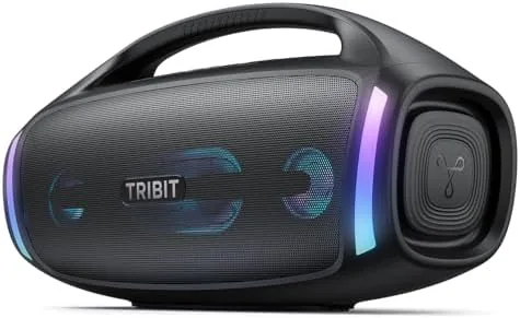 Tribit StormBox Blast 2 portable speaker on a beach towel by the water