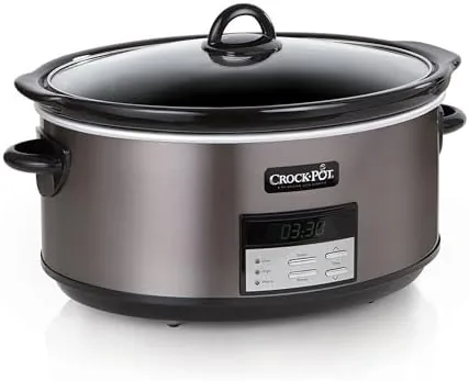 The slow cooker holding a weeknight curry with rice on a table
