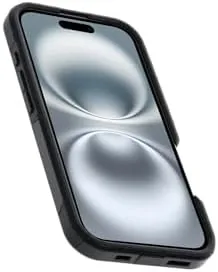 The iPhone 16 in the black Commuter case on a MagSafe charger at night
