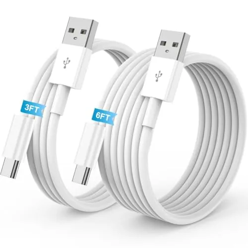 Two USB A to USB C cables coiled on a dashboard