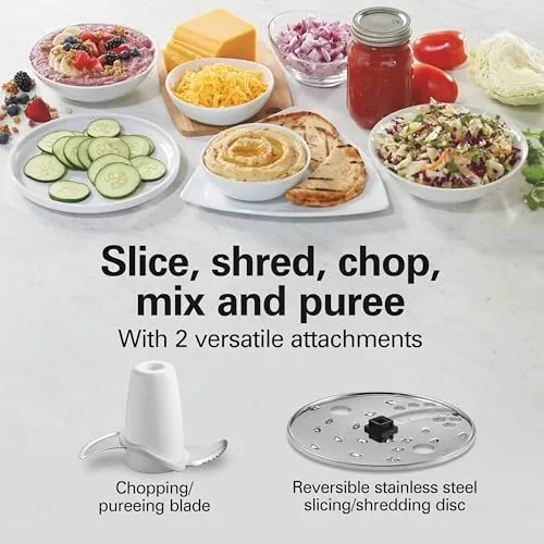 The feed tube and pusher on the lid of the food processor