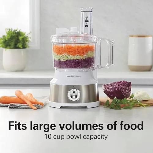 A finished batch of salsa and shredded cheese beside the food processor