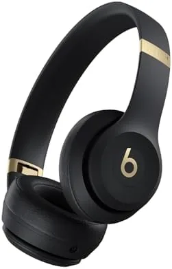 Beats Solo 4 in Black and Gold resting on a desk