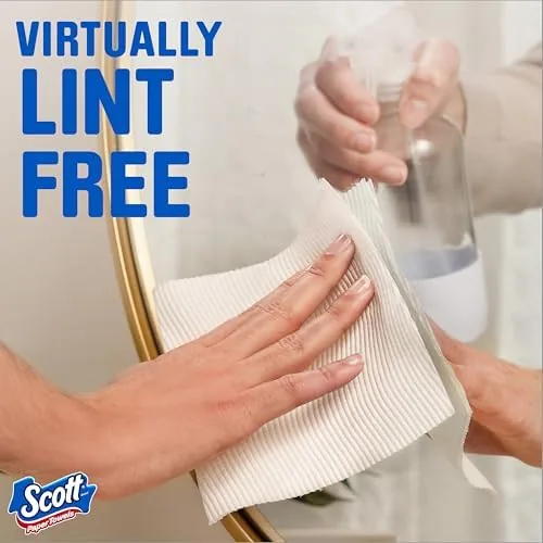 A half sheet wiping a small splash on the counter