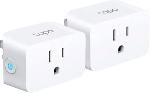 Two Tapo Smart Plug Mini units plugged into a wall outlet in a living room