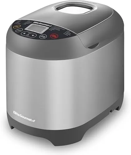 The Elite Gourmet EBM8103SS bread maker on a kitchen counter with a fresh loaf inside