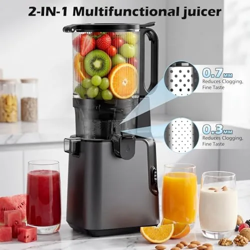 Fresh juice flowing from the juicer spout into a glass with pulp collecting in the tray